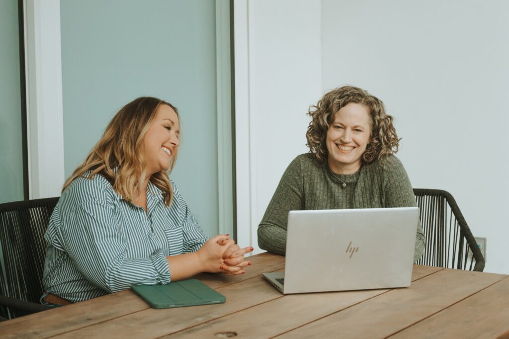 Stephani with a client at a laptop